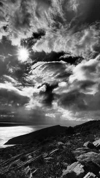 Dramatic Storm Clouds and Sunburst Over Aegean Sea, Kea Island Greece - single Stock Photos