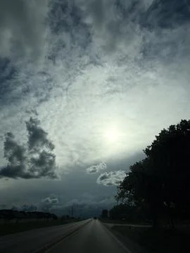 Dramatic Storm Clouds and Sunlight Detailed View Stock Photos