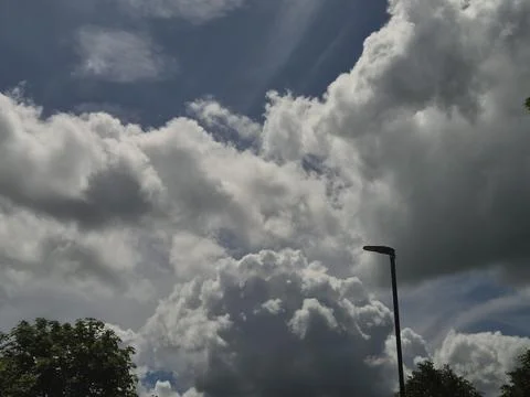 Dramatic storm clouds in a blue sky Stock Photos
