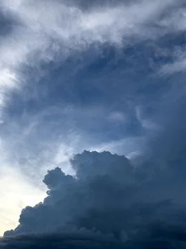 Dramatic Storm Clouds in Blue Sky Фото