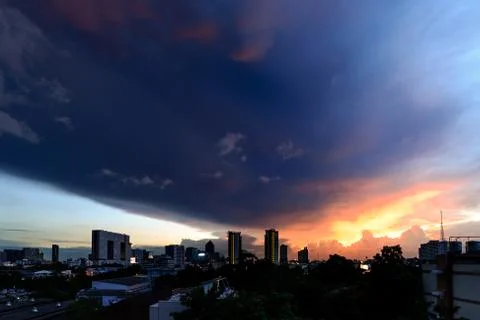 Dramatic storm clouds in city. Stock Photos