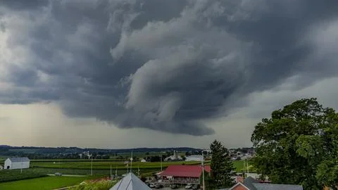 Dramatic Storm Clouds Gather Over a Rural Landscape in the Late Afternoon Stock Photos