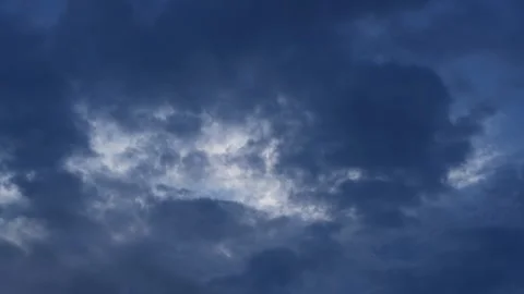 Dramatic storm clouds gathering in blue sky, 8K timelapse. Stock Footage 335094058