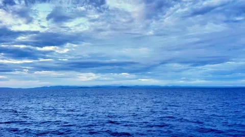 Dramatic Storm Clouds Gathering Over Open Ocean Horizon Stock Footage 335921126