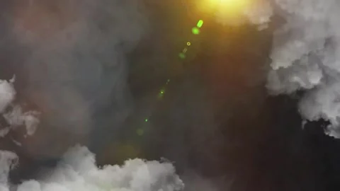 Dramatic storm clouds with golden sun rays and lens flare light effect Stock Footage 342897115