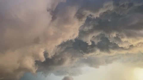 Dramatic storm clouds with golden sunset light Stock-Footage 337903735