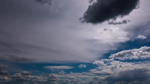Dramatic Storm Clouds Moving Rapidly Across Bright Blue Sky Time Lapse Stock Footage 337453788