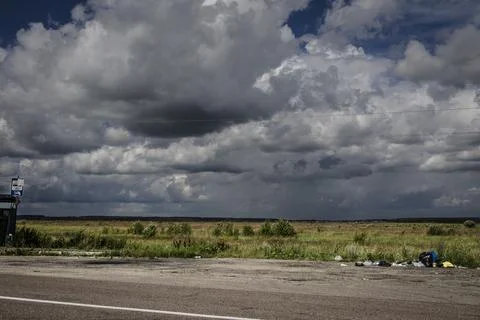 Dramatic Storm Clouds over a Countryside Road in Russia Stock Photos