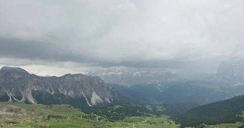 Dramatic storm clouds over the Dolomites mountains in Italy Stock Footage 340780092