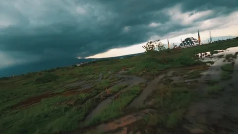 Dramatic Storm Clouds Over Green Field Stock Footage 312496677