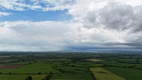 Dramatic Storm Clouds Over Green Rural Farmland 스톡 사진