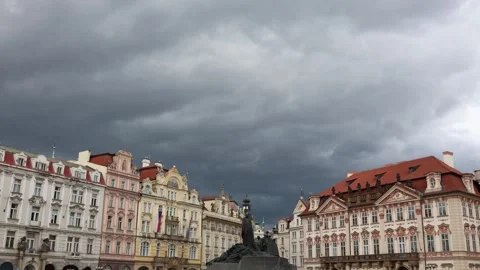 Dramatic storm clouds over historic square with colorful baroque and renaissance Stock Footage 315414537