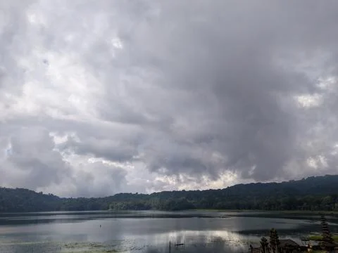 Dramatic Storm Clouds Over Lake Tamblingan, Bali, Indonesia Stockfoto's
