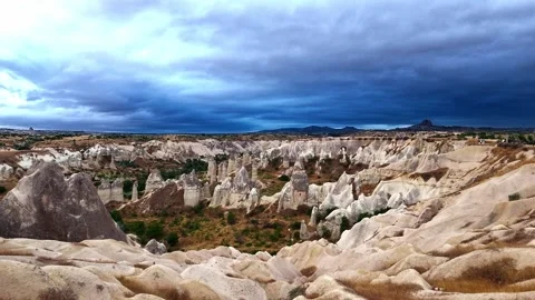 Dramatic Storm Clouds Over Love Valley Rock Formations at Sunrise in Stock Footage 346656038