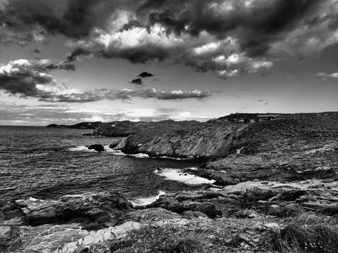 Dramatic Storm Clouds Over Mediterranean Coastline in Greece. Stylised Weather Stock-Fotos