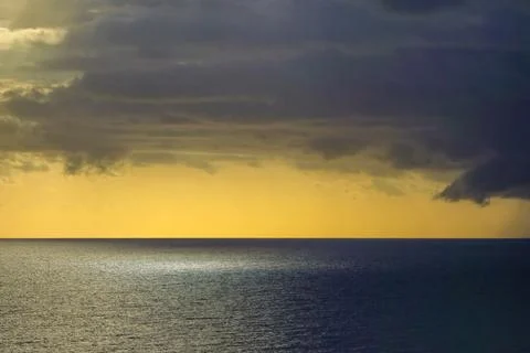Dramatic storm clouds over the Mediterranean Sea at sunset Foto stock