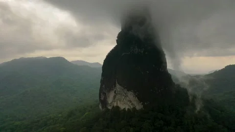 Dramatic storm clouds over mountain peak in São Tomé island Stock Footage 148422083