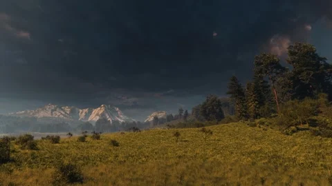 Dramatic storm clouds over mountain valley landscape at sunset or dawn Stock Footage 338230680