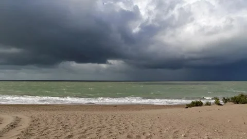 Dramatic Storm Clouds over the Ocean with waves 4K 60fps Stock Footage 302194162