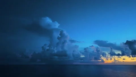 Dramatic Storm Clouds Over Ocean Water at Sunset Stock Footage 344792129
