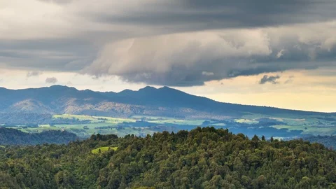 Dramatic storm clouds over Pirongia mountains forest park in New Zealand nature Stock Footage 105804684