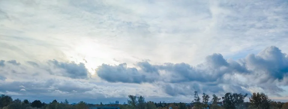 Dramatic Storm Clouds Over Rural Horizon Under Overcast Sky Stock Photos