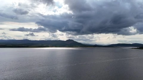 Dramatic Storm Clouds over Scottish Highlands Lake and Mountains - Aerial 4K Stock Footage 330782396