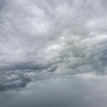Dramatic Storm Clouds With Rain Shaft In Gray Sky Stock Photos