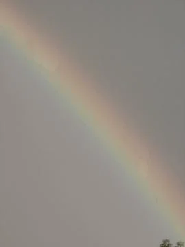 Dramatic storm clouds rainbow nature backdrop Stock Photos