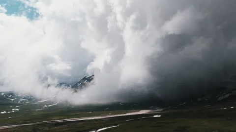 Dramatic storm clouds rolling over mountain valley, time-lapse Stock Footage 337104055