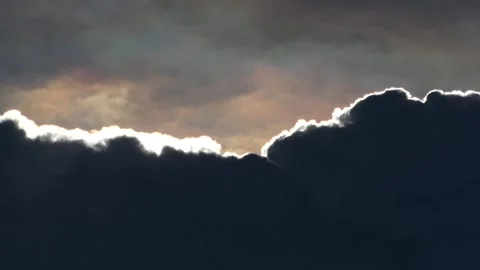 Dramatic storm clouds with silver lining backlight, moody weather atmospher.. Video stock 345198257