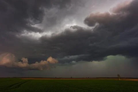 Dramatic storm clouds in the sky, dark severe storm clouds, supercell. Stock Photos