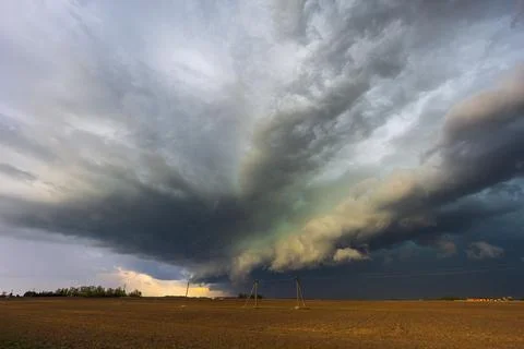 Dramatic storm clouds in the sky, dark severe storm clouds, supercell. Stock Photos