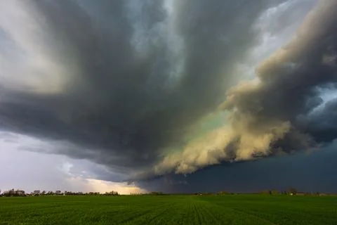 Dramatic storm clouds in the sky, dark severe storm clouds, supercell. Stock Photos