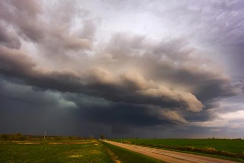 Dramatic storm clouds in the sky, dark severe storm clouds, supercell. Stock Photos