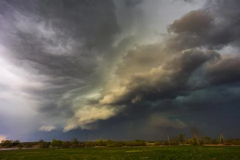 Dramatic storm clouds in the sky, dark severe storm clouds, supercell. Stock Photos