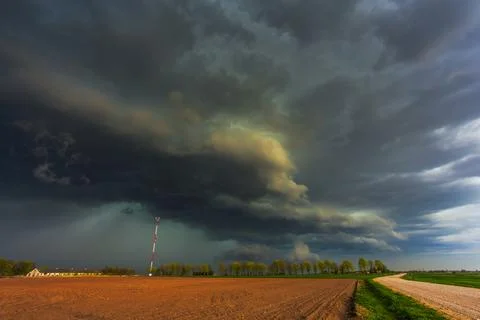 Dramatic storm clouds in the sky, dark severe storm clouds, supercell. Stock Photos