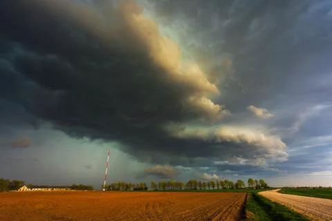 Dramatic storm clouds in the sky, dark severe storm clouds, supercell. Stock Photos