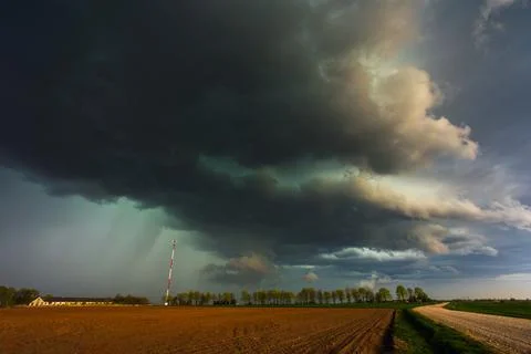 Dramatic storm clouds in the sky, dark severe storm clouds, supercell. Stock Photos