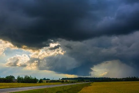 Dramatic storm clouds in the sky, dark severe storm clouds, supercell Stock Photos