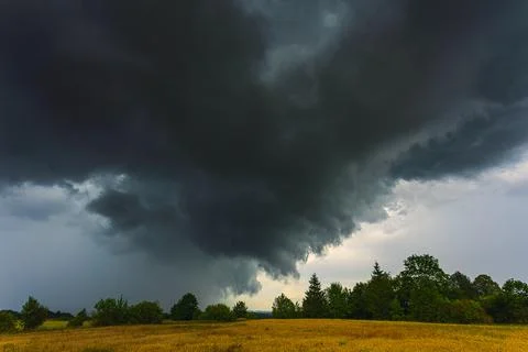 Dramatic storm clouds in the sky, dark severe storm clouds, supercell. Stock Photos