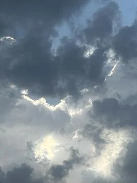 Dramatic Storm Clouds with Sunlight Breaking Through Stock Photos