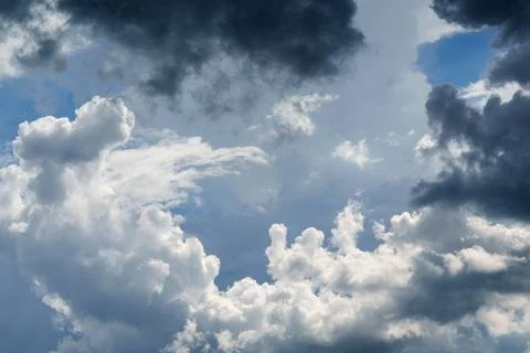 Dramatic Storm Clouds with Sunlight Breaking Through Before Rain. Weather. Stock Photos