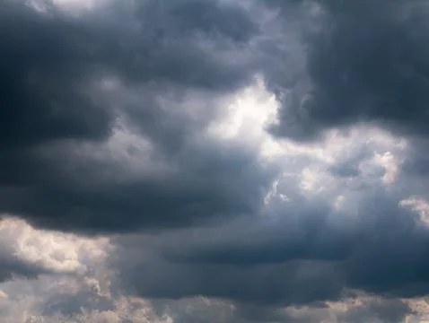 Dramatic Storm Clouds with Sunlight Breaking Through, Moody Sky Background Stock Photos