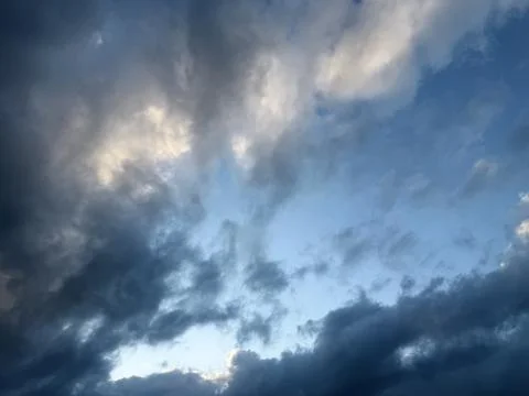 Dramatic Storm Clouds with Sunlight Breaking Through Stock Photos