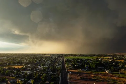 Dramatic storm clouds sweep across the sky at sunset. 스톡 사진