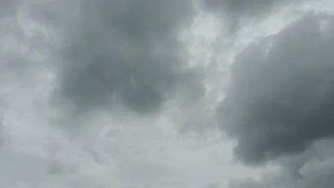 Dramatic storm clouds thunder flashing on dark fast moving cloudy sky timelapse Stock Footage 161977611