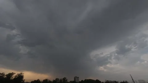Dramatic Storm Clouds Time Lapse with Sun Breaking Through at Golden Hour Stock Footage 331582878