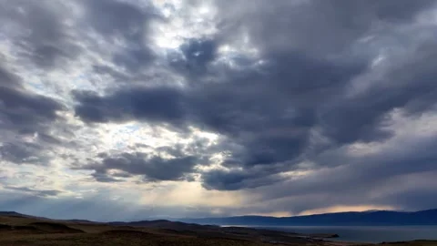 Dramatic storm clouds timelapse over coastal landscape. Stock Footage 328336927