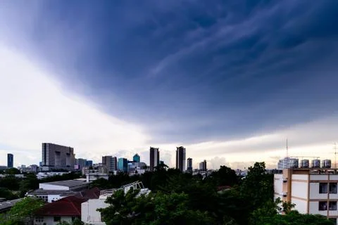 Dramatic storm cloudy in city. Stock Photos